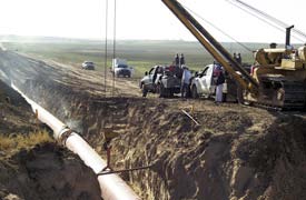 Figure 3.2 : Showing new pipe line construction site Sarir project have team to design a new site through professional service of creating and developing concepts and specifications that optimize the function, value and appearance of products and systems for the mutual benefit of both user and manufacturer. In designing the location, Sarir determine suitable plant location for interrupted operation and maintaining pipelines and safety fig 3.2. Factors influence the effectiveness of the plant location are near to oil field, employee, material handling, strategic objectives, and socio economic factors. The eeffective plant location factors will achieve various objectives like efficient utilization of available land space, minimizes cost, allows flexibility of operation, provides for employees convenience, improves productivity etc.The entrepreneurs must possess the expertise to lay down a proper layout for new or existing plants. It differs from one plant to another. But basic principles to be followed are more or less same. Although, this report is mainly conducted with Sirir Gas turbine in main but it is applicable to all types of industries or plants.Some problem error related to this design on the plant location of the Sarir is related with gas and geographic expansion should provide access to a fresh market and to additional resources. An optimum location can reduce the cost of production and distribution to a great extent. Thus great care and appropriate planning is required to select the most